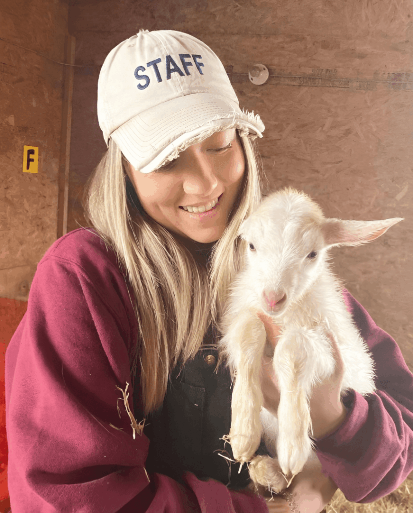 staff holding goat